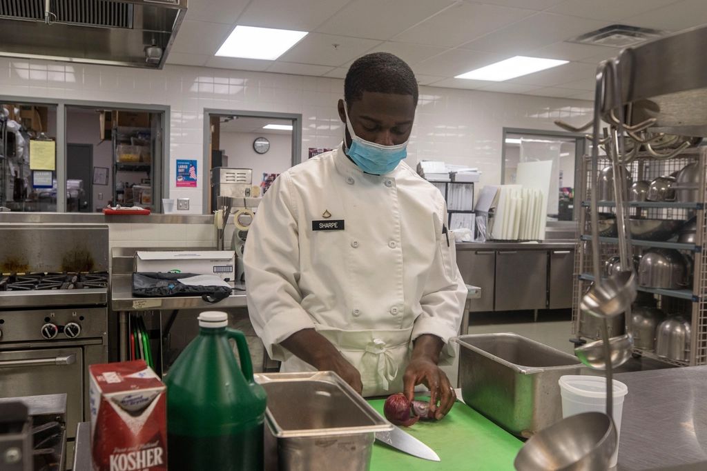 A cook working at the open kitchen