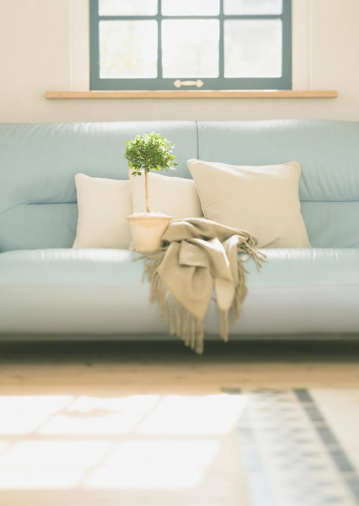 A suite sitting room with a sofa and armchairs